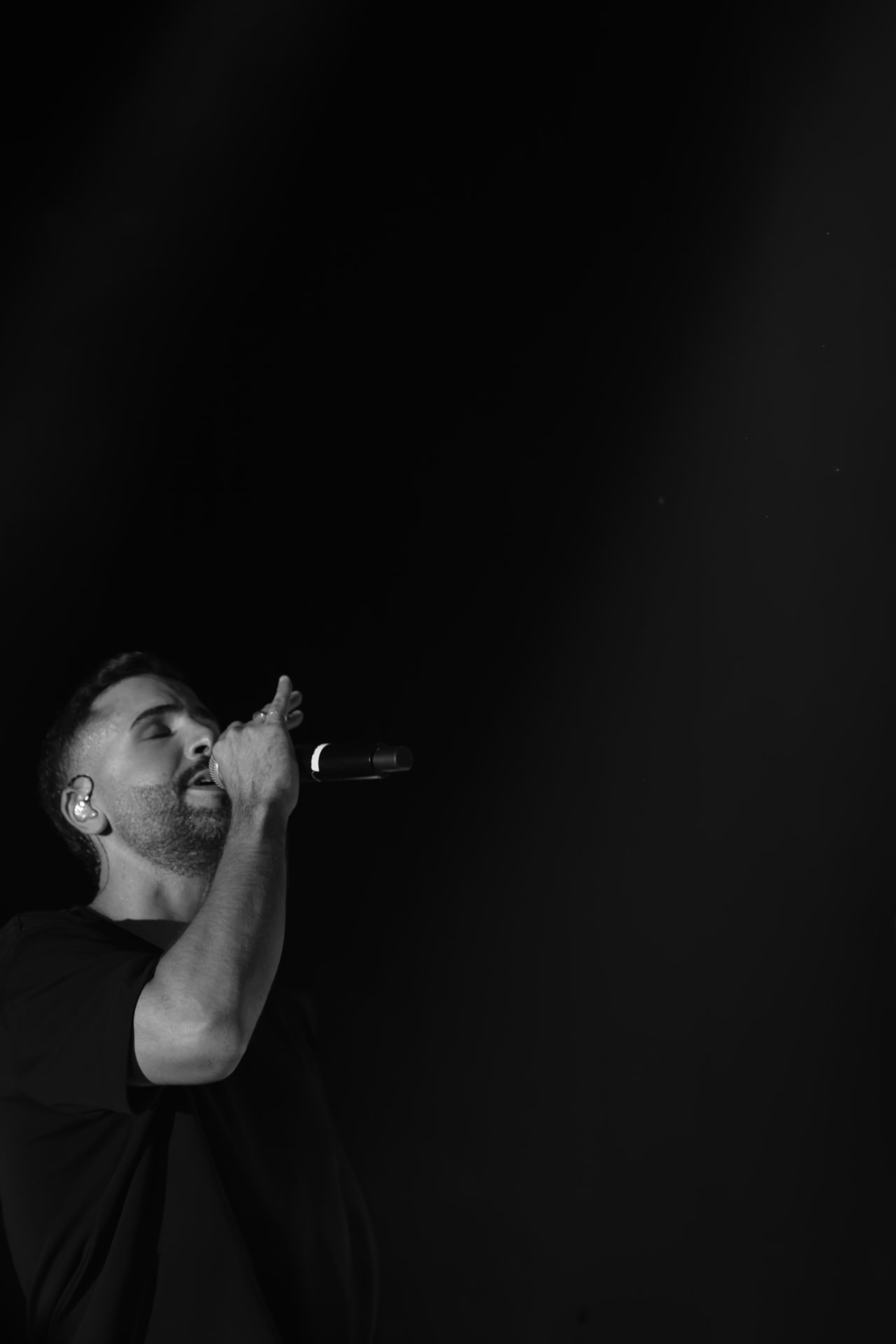 Yonatan Kalimi singing in black and white